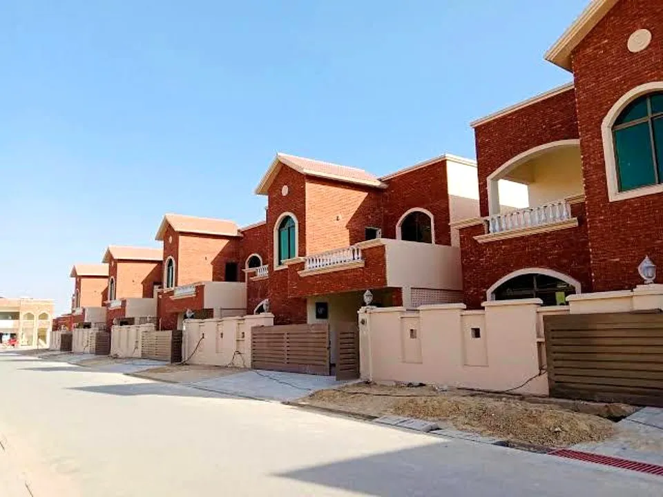 Row of brick-faced houses on a street, Askari-I